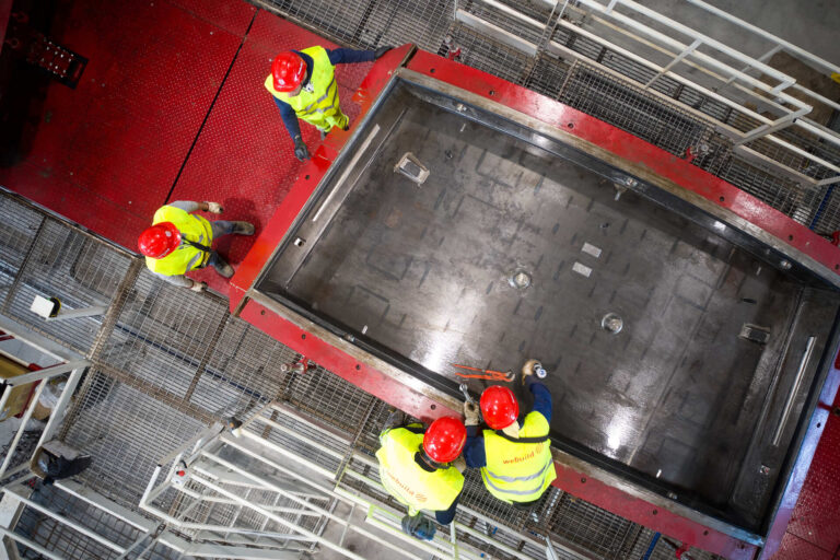   Workers from the Webuild Group working at the Roboplant facility  